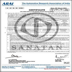 person writing in a notebook beside by an iPad, laptop, printed photos, spectacles, and a cup of coffee on a saucer